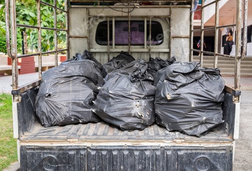Preview: Black garbage bag stacked on truck