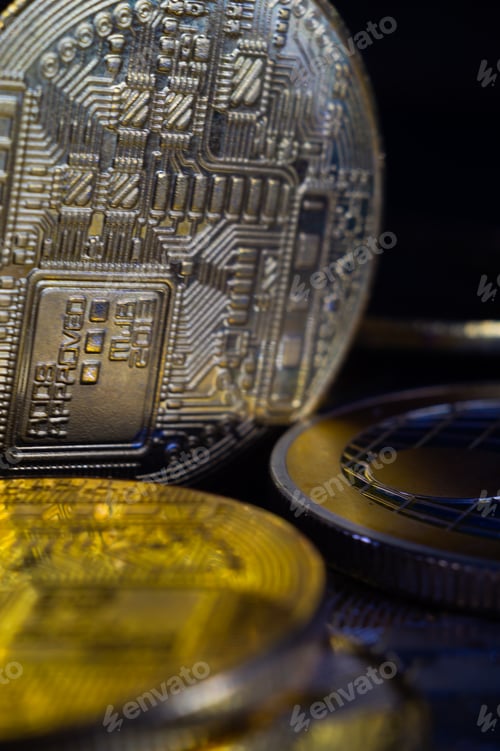 Preview: Vertical closeup of bitcoins on dark background.