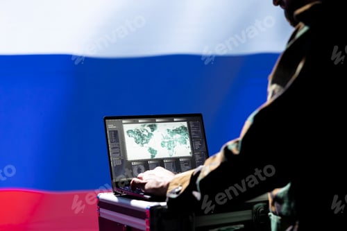 Preview: Hacker Working on Computer With World Map