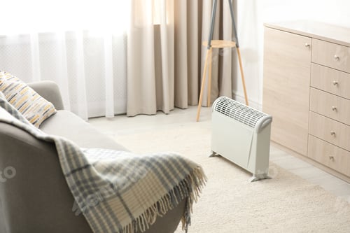 Preview: Modern electric heater in stylish room interior