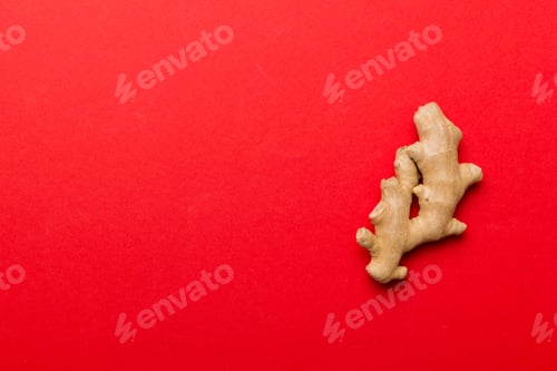 Preview: Finely dry Ginger powder in bowl with green leaves isolated on colored background. top view flat lay