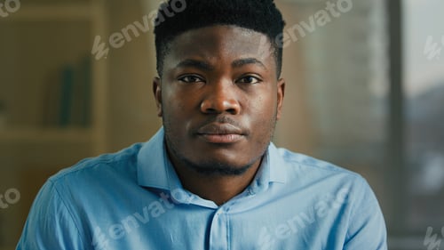 Preview: Headshot serious face leader in office studio male ethnic African American man looking to camera