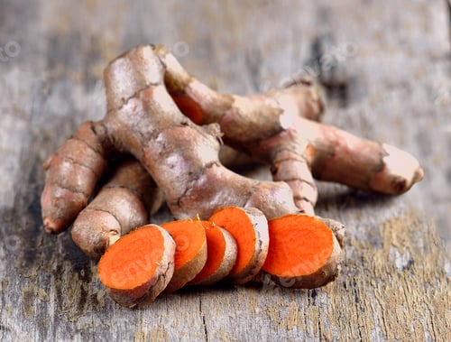 Preview: pile of fresh turmeric roots on wooden table