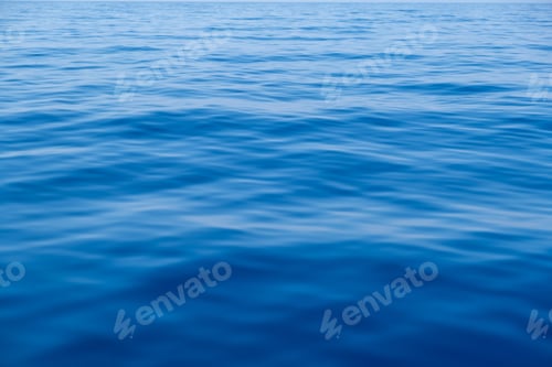 Preview: Sea water surface calm with small ripples. Still ocean, deep blue color background,