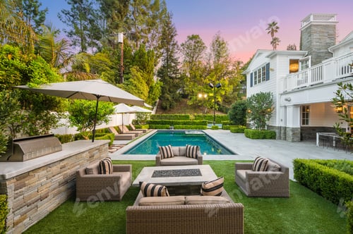 Preview: Poolside patio with outdoor dining table in a new construction home in Encino, California