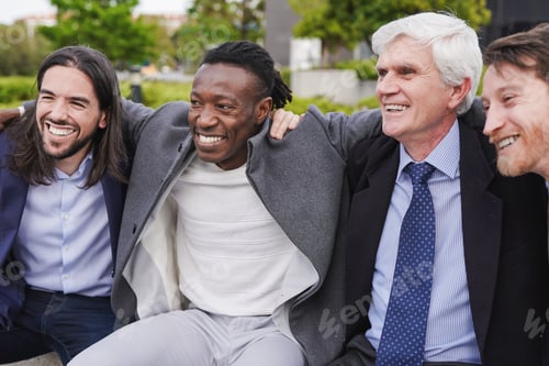 Preview: Group of multiethnic business men having fun during lunch break outdoor