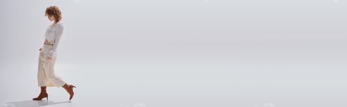 Preview: Curly woman showcases elegant spring fashion in stylish studio atmosphere