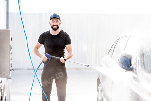 Preview: Man washing car with water gun