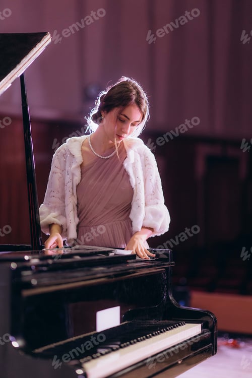 Preview: A woman on stage before a concert repeats notes at the piano