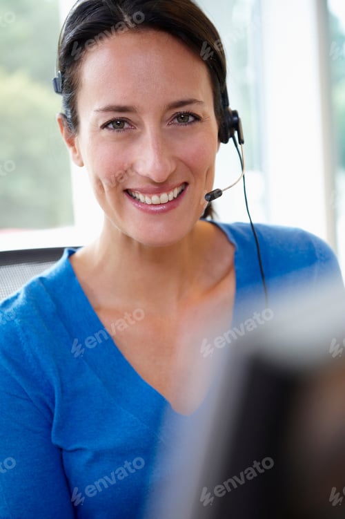 Preview: Receptionist behind her desk, smiling