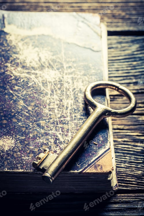 Preview: Closeup of aged books and keys