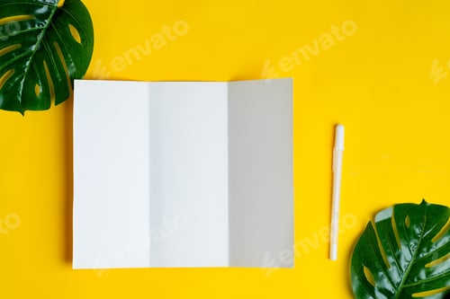 Preview: Minimal trifold brochure template above yellow background