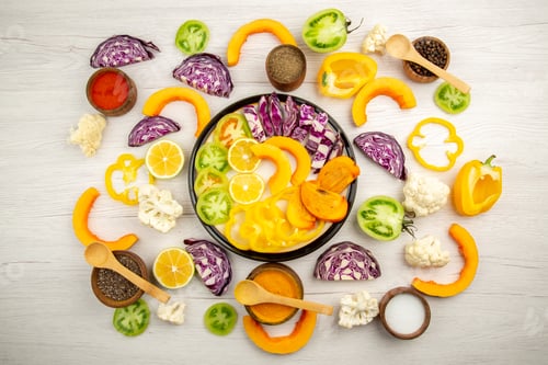 Preview: top view cut vegetables and fruits pumpkin persimmon red cabbage lemon green tomatoes cauliflower