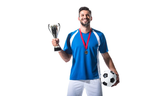 Preview: happy soccer player with trophy cup and medal Isolated On White
