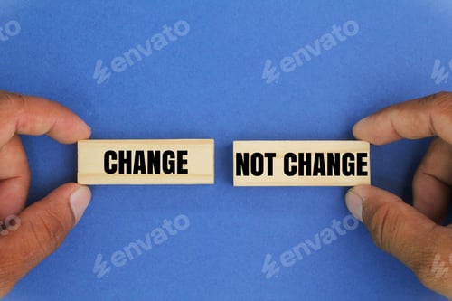 Preview: hand holding a stick with the words change or not change.