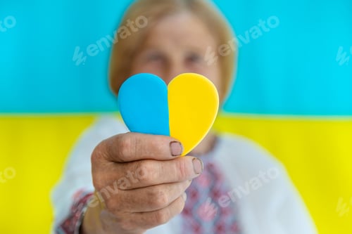 Preview: Grandmother is a Ukrainian patriot in an embroidered shirt. selective focus.