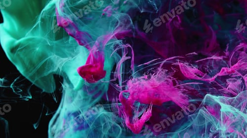 Preview: Pink Blue Ink Dropped Into Water. Lovely shining metamorphosis. Ink splatter. Volume effect.