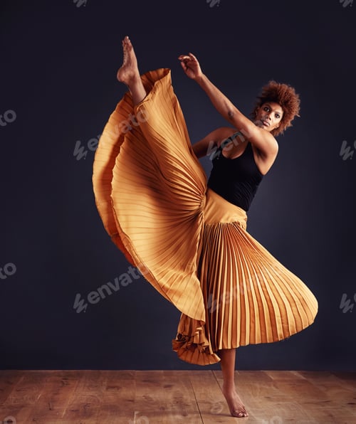 Preview: Dedication to expression. Female contemporary dancer in a dramatic pose against dark background.