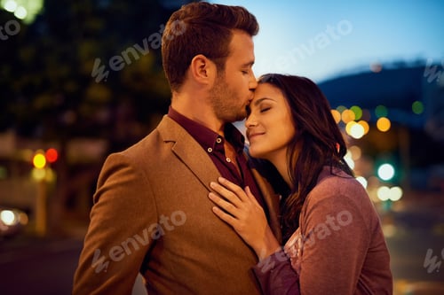 Preview: Cropped shot of an affectionate young couple enjoying a night out