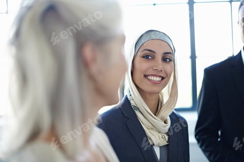 Preview: Over shoulder view of businesswomen chatting in office