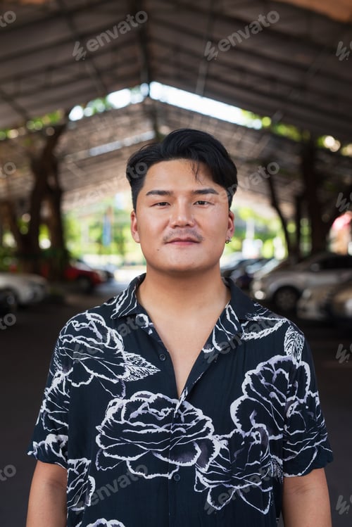 Preview: Portrait of Handsome Young Asian Man Outdoors in City
