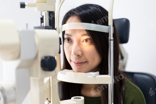Preview: Patient having a medical examination at optical clinic