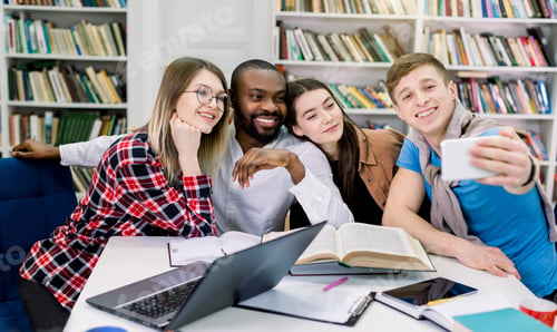 Preview: people, fun, education, technology and school concept - happy four multiethnical students making