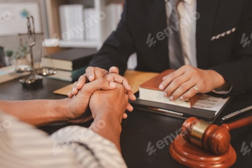 Preview: A professional lawyer discussing legal matters with a client in an office