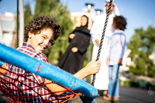 Preview: Cinematic image of a family playing at the playground