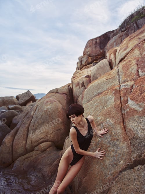Preview: Paradise Escape: A Slim, Pretty Lady Enjoying Body Relaxation and Freedom on a Seashore at Sunset