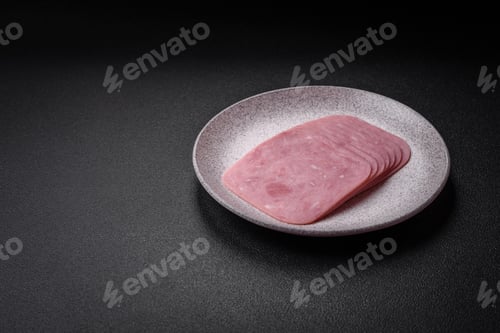 Preview: Delicious fresh ham cut into slices with salt, spices and herbs