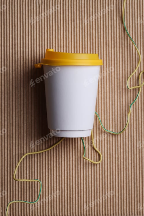 Preview: White blank takeaway paper recycle cup with yellow lid on brown ribbed background , mock up