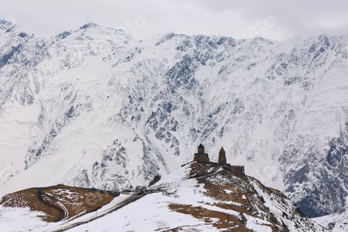 Preview: Snow-covered mountains in the backdrop of the Gergeti Trinity Church in Stepantsminda, Georgia