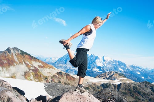 Preview: Woman doing balancing yoga pose on Mount Baker, Snoqualmie National Forest, North Cascades.