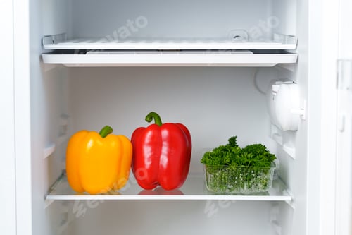 Preview: Yellow and Red Bell Peppers and Parsley in a Refrigerator