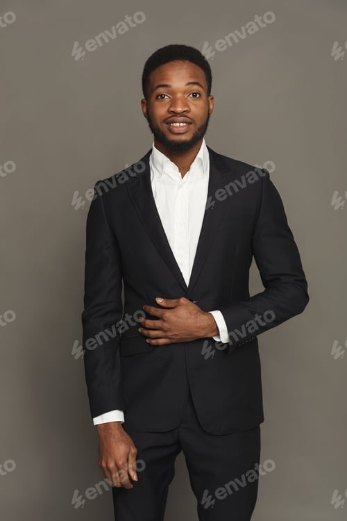 Preview: Handsome young black man portrait at studio background.