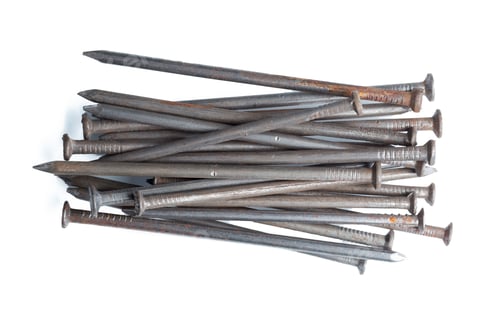Preview: Pile of metal nails, construction hardware material on white background