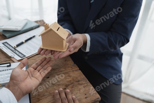 Preview: Real estate agents, insurance agents , The businessman delivers the model house or model house to th