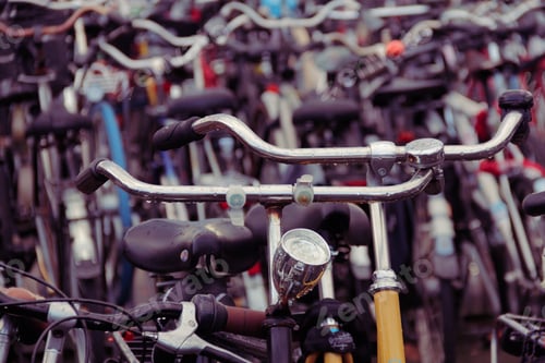 Preview: Closeup shot of bunch of bicycles parked in a main station of Amsterdam, Netherlands