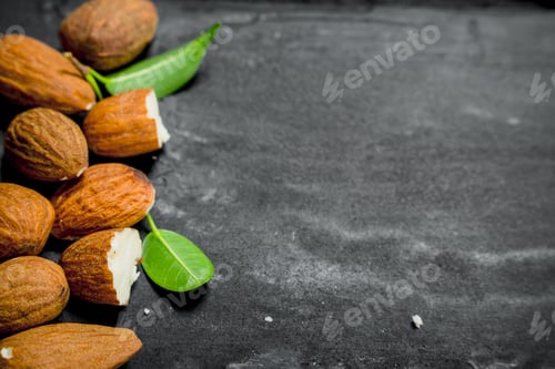 Preview: Almonds with green leaves.