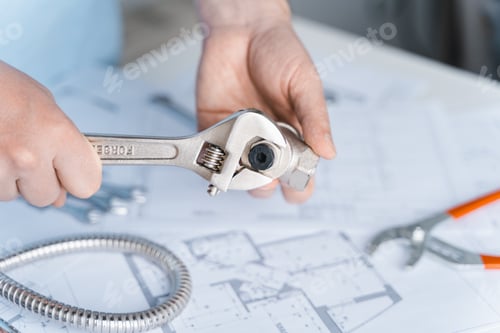 Preview: Plumbing project in house.Drawing,diagrams,plan of water supply of apartment,building.Man repairer