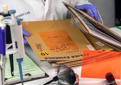 Preview: Police scientist searches for criminal file in crime lab, conceptual image