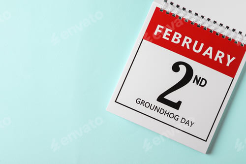 Preview: Top view of calendar with date February 2nd on light blue background, space for text. Groundhog day
