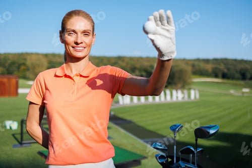 Preview: Youthful Golfer Holding Golf Ball