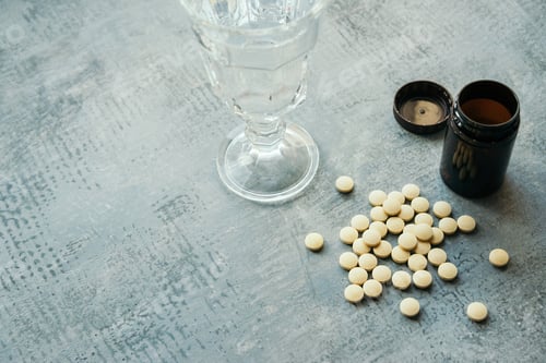 Preview: yellow round tablets or pills vitamins