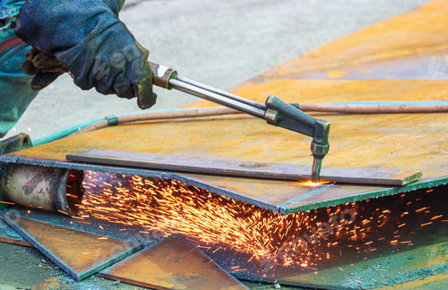 Preview: Close up of welder hand is cutting iron plate with acetylene gas welding torch machine at workshop