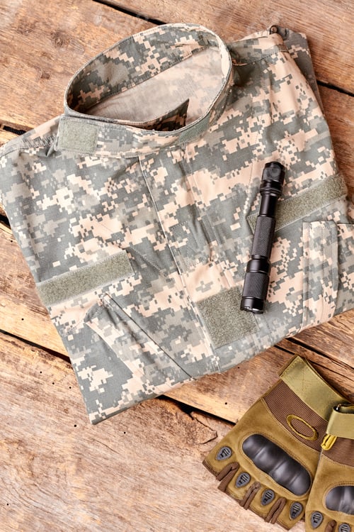 Preview: Set of military outfit on brown wooden background, flat lay