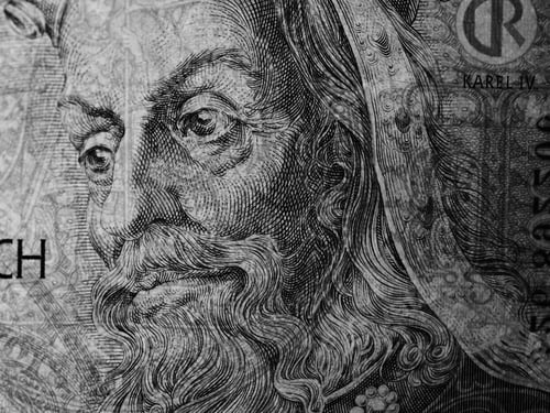 Preview: Closeup black and white shot of a Czech banknote of a hundred koruna with King Korel on it