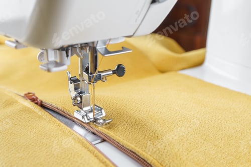 Preview: Modern Sewing Machine With Yellow Velours Fabric Close Up