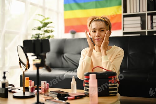 Preview: Young queer man beauty make up artist or vlogger recording makeup tutorial.